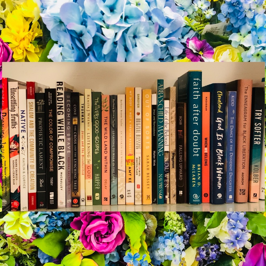 A shelf of books (mostly related to faith and justice) with a brightly colored floral background. See bottom of webpage for a list of the books pictured.